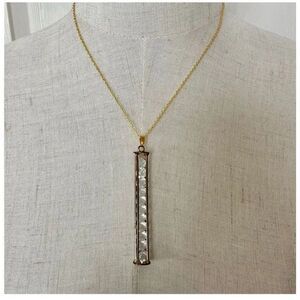 Gold tone long caged rhinestone necklace